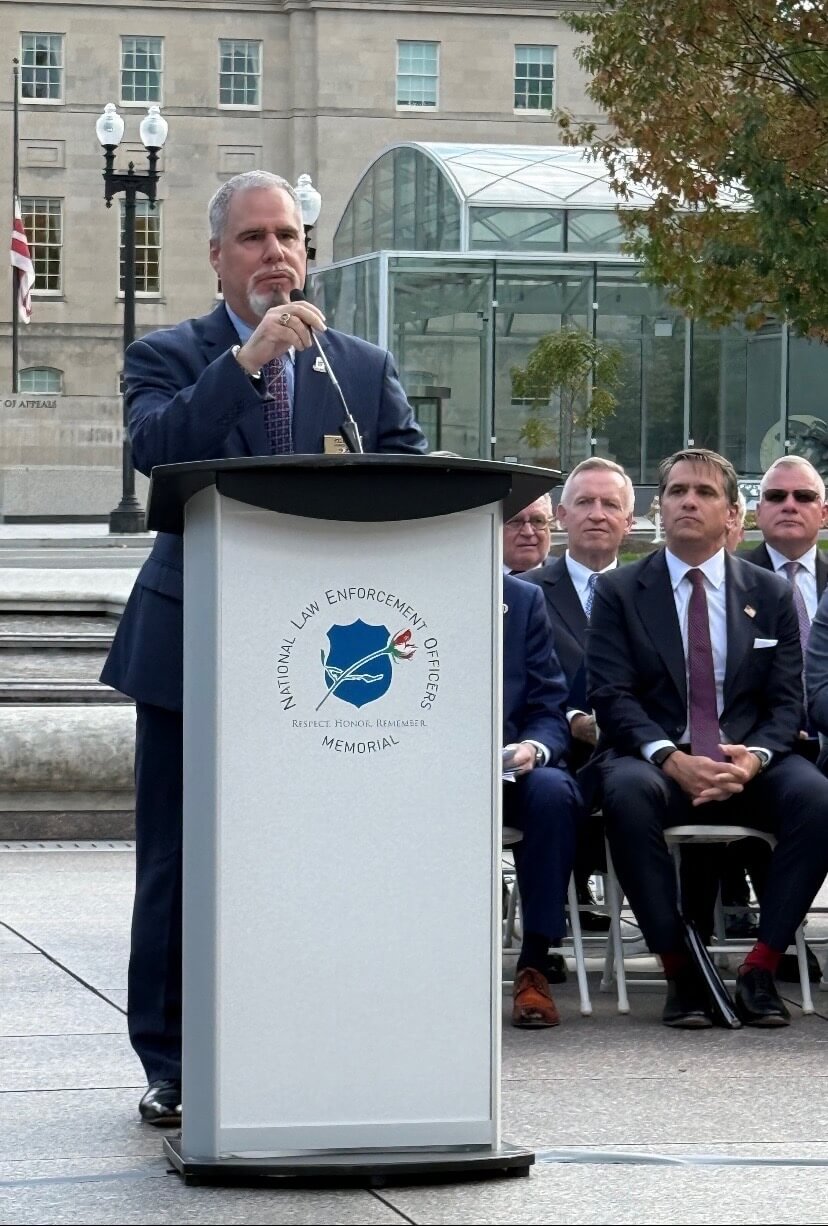 Jon Adler speaking at police memorial ceremony
